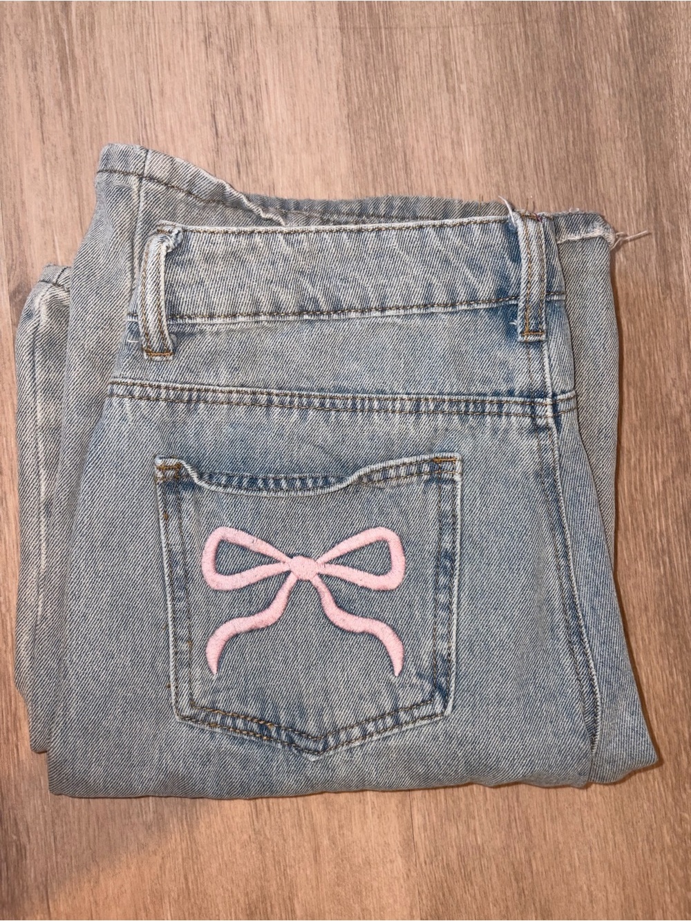 Edikted blue jeans with pink bow on pockets